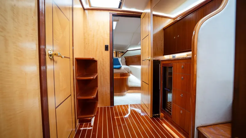 Trident Yacht Photos Pics Luxurious interior of 2015 Maverick Yachts Costa Rica 50, featuring elegant wood finishes.
