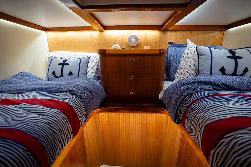 Trident Yacht Photos Pics Luxurious twin cabin in 2015 Maverick Yachts Costa Rica 50, featuring nautical-themed bedding.