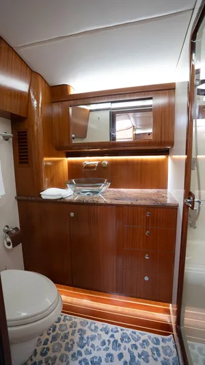 Trident Yacht Photos Pics Luxurious 2015 Maverick Yachts Costa Rica 50 bathroom with wood finish and modern fixtures.