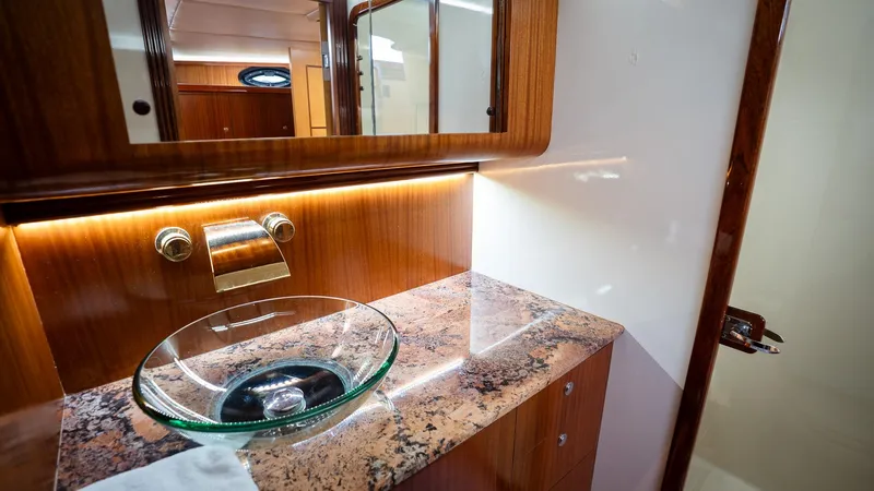 Trident Yacht Photos Pics Luxurious bathroom interior of 2015 Maverick Yachts Costa Rica 50, featuring elegant glass sink.
