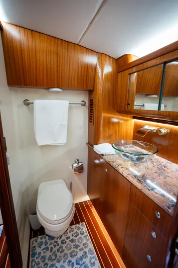 Trident Yacht Photos Pics Luxurious bathroom in 2015 Maverick Yachts Costa Rica 50, featuring wood accents and modern fixtures.