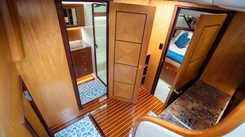 Trident Yacht Photos Pics Luxurious interior of 2015 Maverick Yachts Costa Rica 50, featuring wood finishes and elegant design.