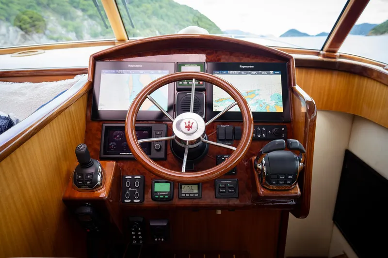 Trident Yacht Photos Pics Helm of 2015 Maverick Yachts Costa Rica 50 with navigation screens and controls.