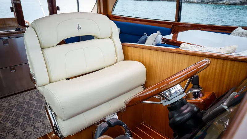 Trident Yacht Photos Pics Luxurious interior of 2015 Maverick Yachts Costa Rica 50 with plush seating and wooden accents.