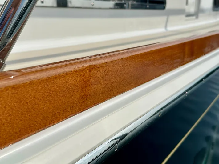 Encore Yacht Photos Pics Polished wood detail on 2017 Sabre 42 Salon Express yacht exterior.