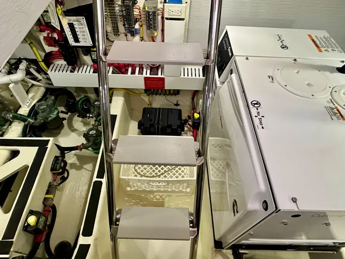 Encore Yacht Photos Pics Engine room of 2017 Sabre 42 Salon Express with equipment and ladder.