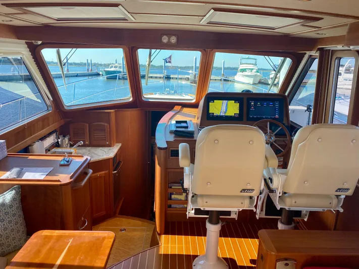 Encore Yacht Photos Pics Interior of 2017 Sabre 42 Salon Express yacht with helm and seating area.