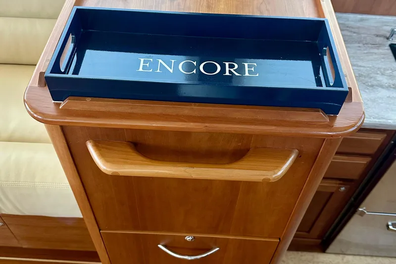 Encore Yacht Photos Pics Wooden cabinet with "Encore" tray on Sabre 42 Salon Express, 2017 model.