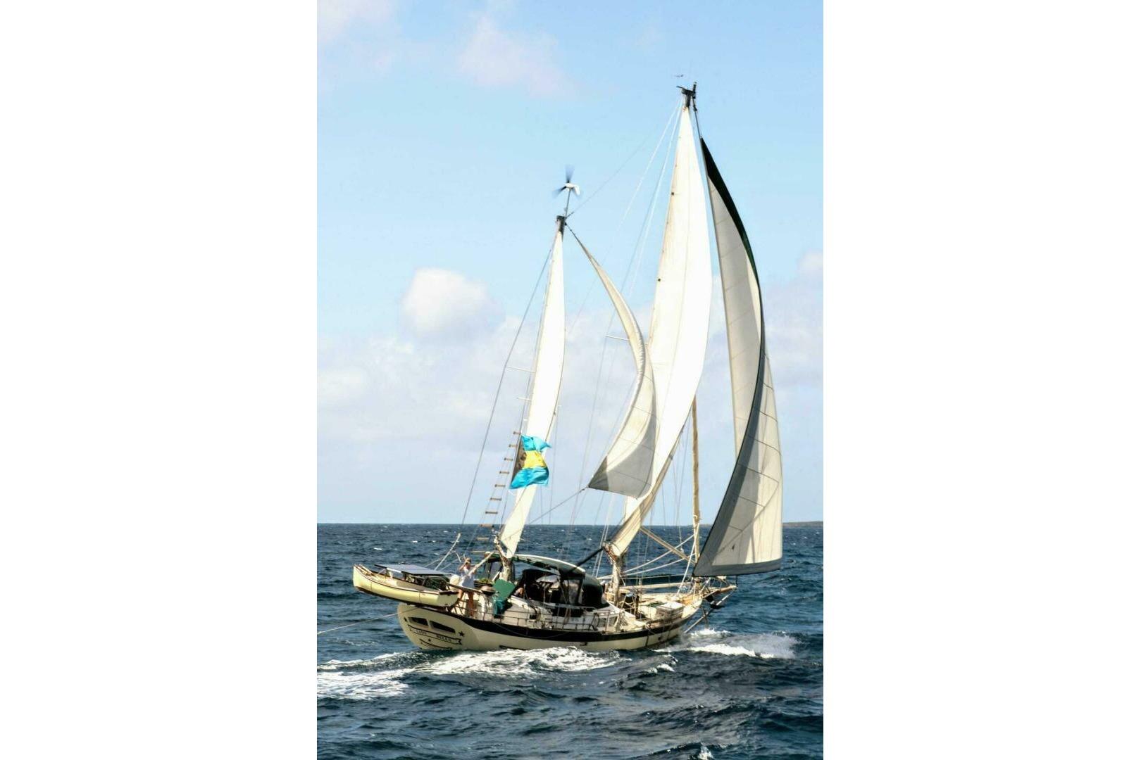 Sailing yacht Hardin 45 from 1980 navigating open sea with full sails.