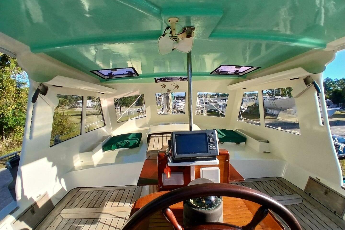Interior view of 1980 Hardin 45 sailboat cockpit with navigation equipment.