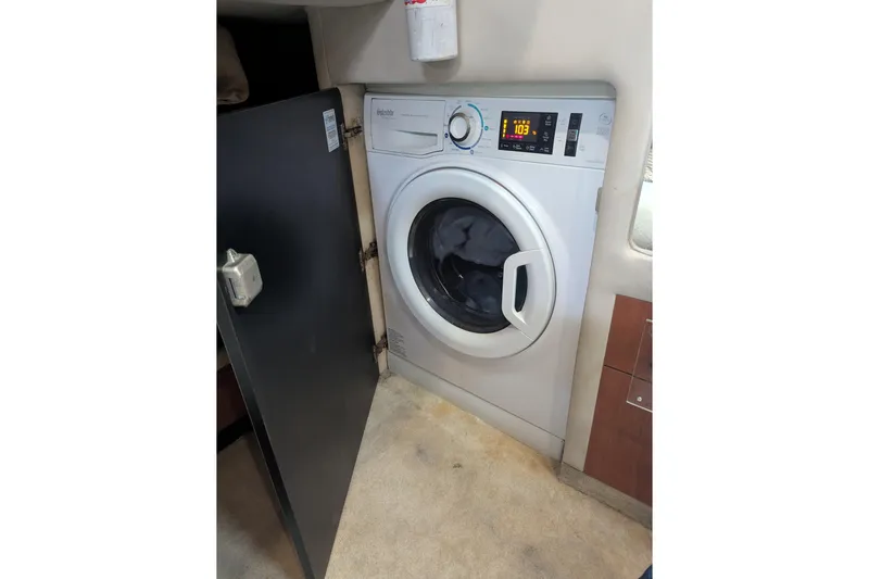  Yacht Photos Pics Washing machine inside 1998 Sea Ray 480 Sedan Bridge yacht cabin.