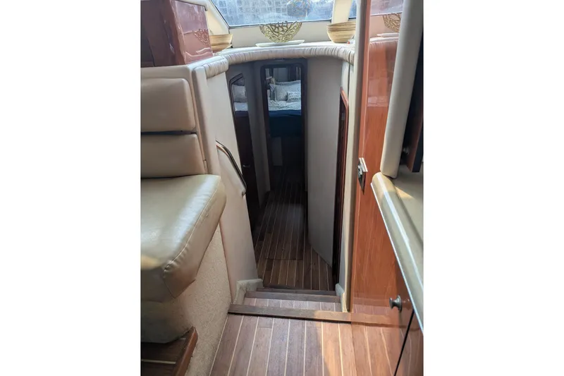  Yacht Photos Pics Interior view of 1998 Sea Ray 480 Sedan Bridge yacht with wooden flooring.
