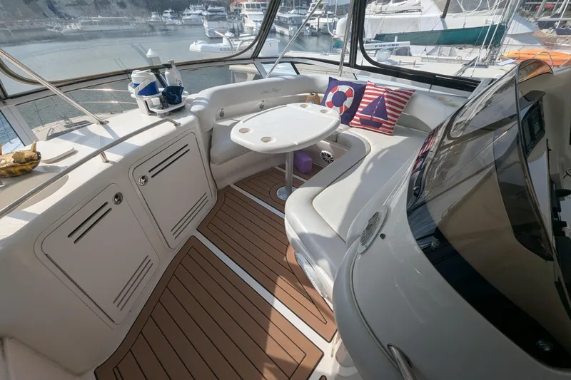  Yacht Photos Pics Luxurious 1998 Sea Ray 480 Sedan Bridge yacht interior with seating and nautical decor.