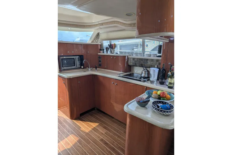  Yacht Photos Pics Luxurious kitchen interior of 1998 Sea Ray 480 Sedan Bridge yacht.
