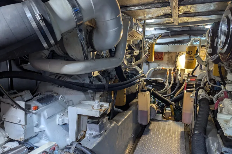  Yacht Photos Pics Engine room of a 1998 Sea Ray 480 Sedan Bridge yacht, showcasing mechanical components.