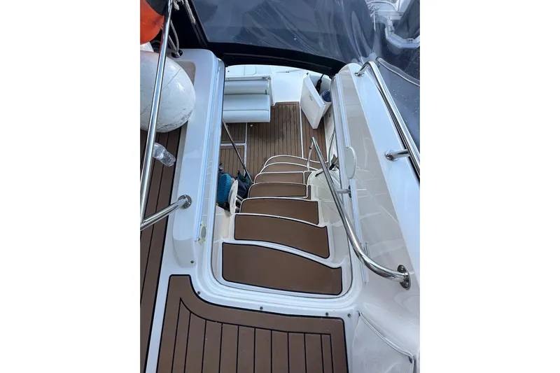  Yacht Photos Pics Staircase on 1998 Sea Ray 480 Sedan Bridge yacht with teak flooring and stainless steel railings.