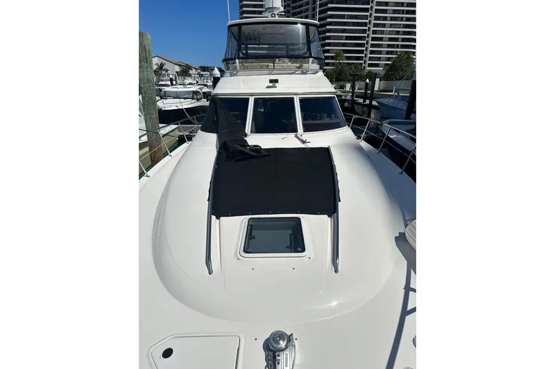  Yacht Photos Pics 1998 Sea Ray 480 Sedan Bridge yacht docked at marina, showcasing sleek design and spacious deck.