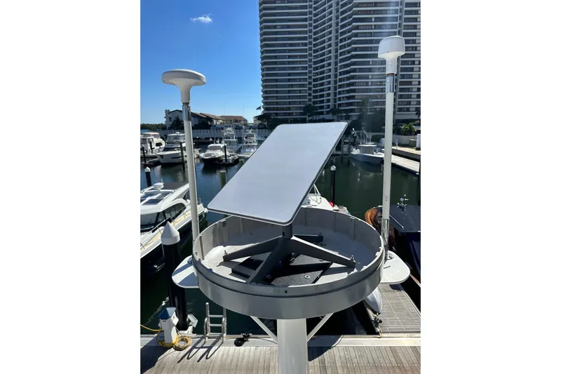  Yacht Photos Pics 1998 Sea Ray 480 Sedan Bridge with satellite equipment in marina setting.