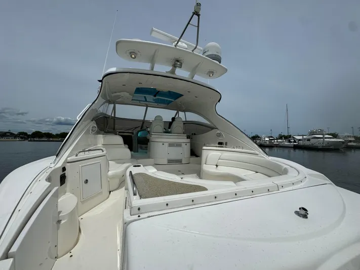  Yacht Photos Pics 2003 Cruisers Yachts 540 Express, spacious deck, luxury seating, docked in marina.