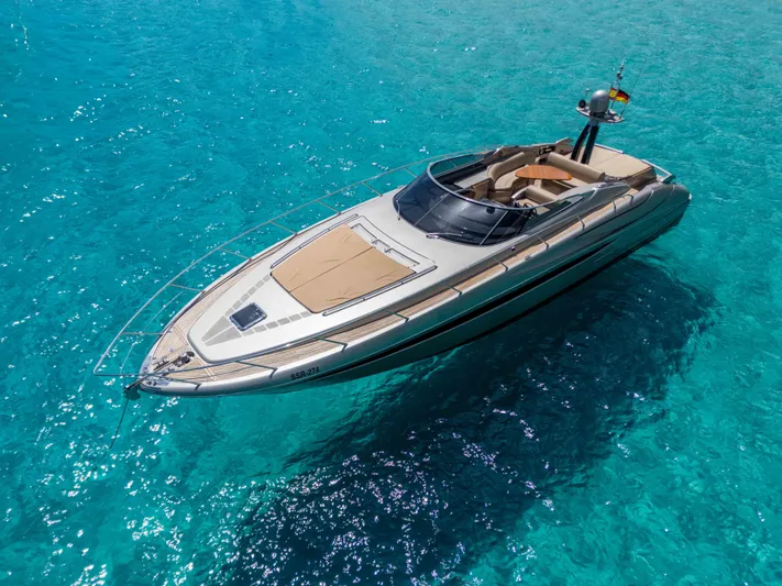 Vimojal II Yacht Photos Pics Luxurious 2009 Riva 52' le yacht on clear turquoise water.