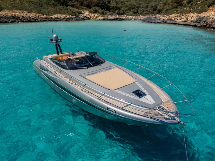 Vimojal II Yacht Photos Pics Luxurious 2009 Riva 52' le yacht anchored in crystal-clear turquoise waters.