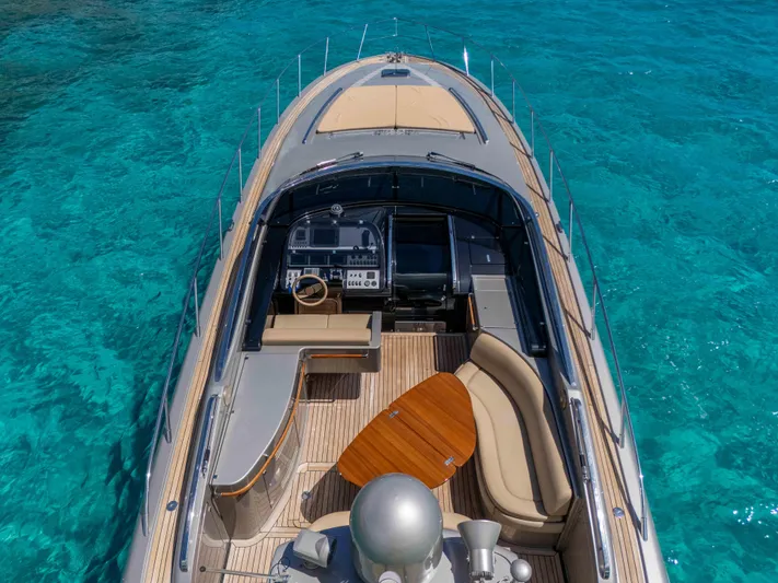 Vimojal II Yacht Photos Pics Luxurious 2009 Riva 52' le yacht on clear turquoise water, featuring elegant deck and seating area.