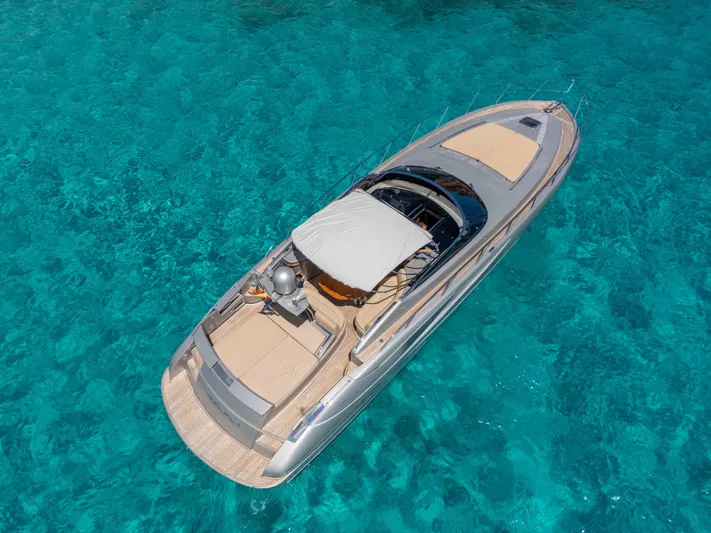 Vimojal II Yacht Photos Pics Luxurious 2009 Riva 52' le yacht on crystal-clear turquoise water.