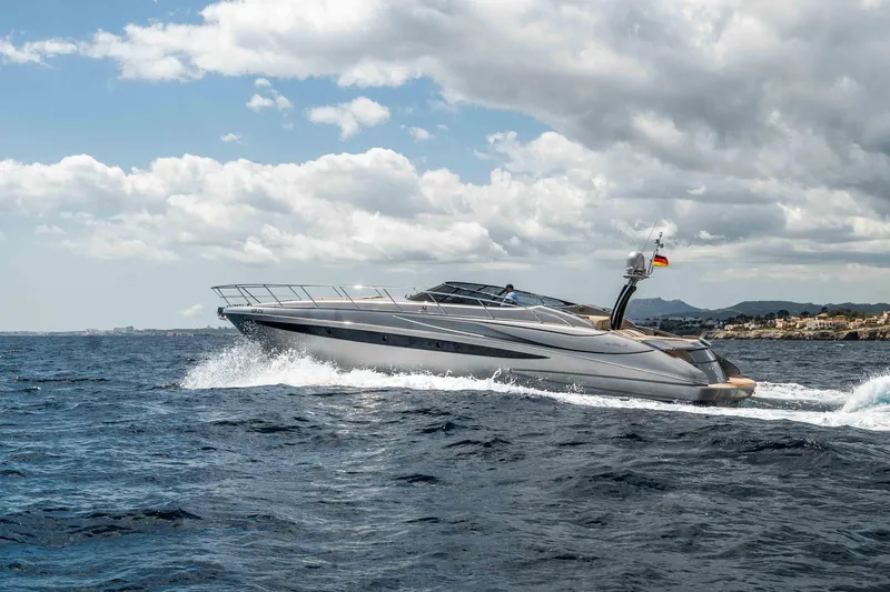 Vimojal II Yacht Photos Pics 2009 Riva 52' le yacht cruising on open sea under cloudy sky.