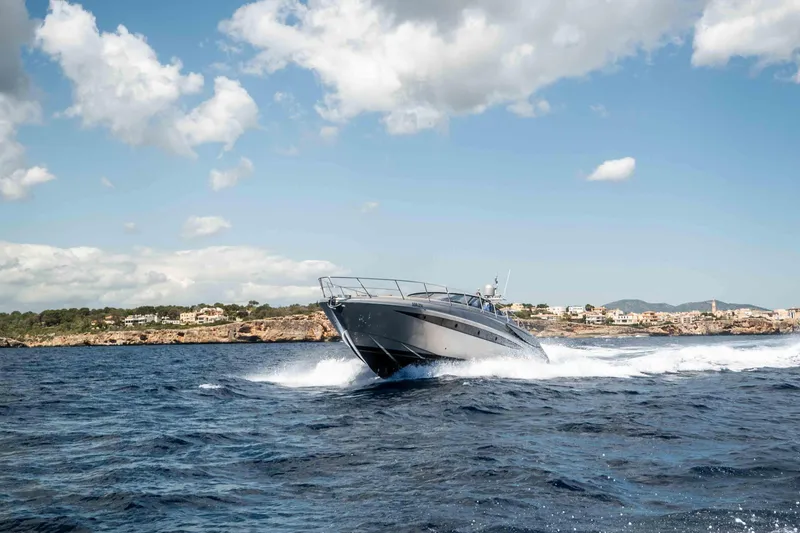 Vimojal II Yacht Photos Pics 2009 Riva 52' le yacht cruising on open water under a clear sky.