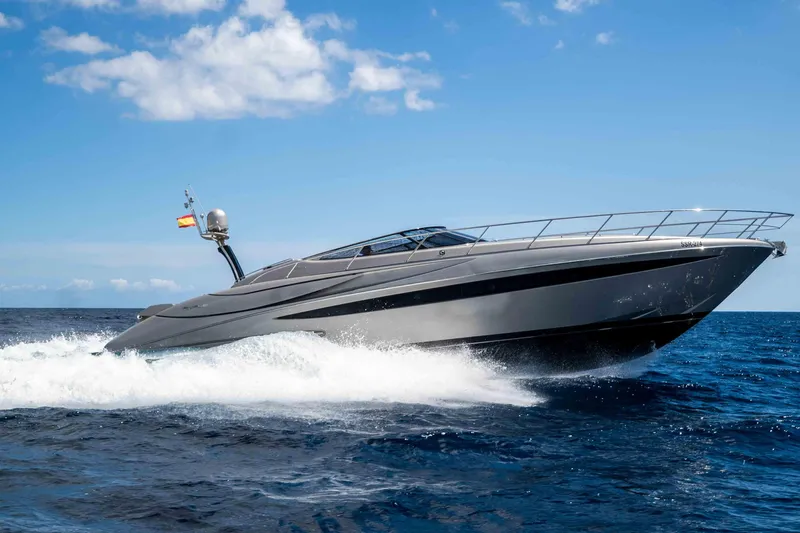 Vimojal II Yacht Photos Pics 2009 Riva 52' le yacht cruising on open sea under clear blue sky.