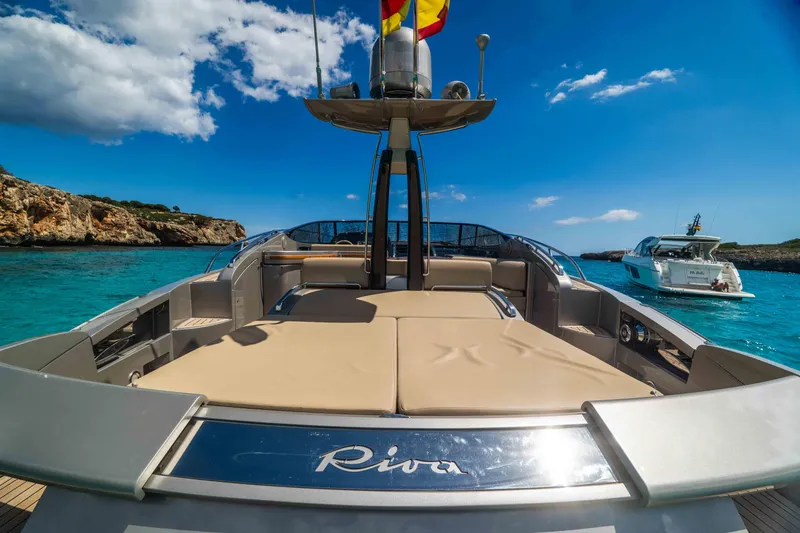 Vimojal II Yacht Photos Pics Luxurious 2009 Riva 52' le yacht on clear blue waters, sunny day.