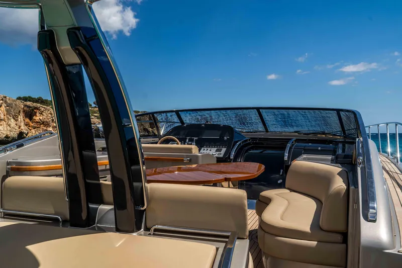 Vimojal II Yacht Photos Pics Luxurious 2009 Riva 52' le yacht interior with elegant seating and sleek dashboard.