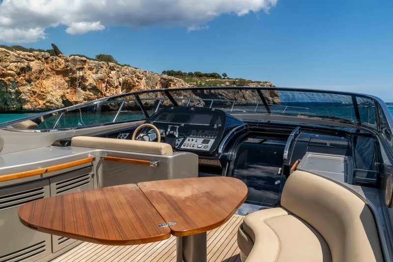 Vimojal II Yacht Photos Pics Luxurious 2009 Riva 52' le yacht interior with elegant seating and scenic ocean view.