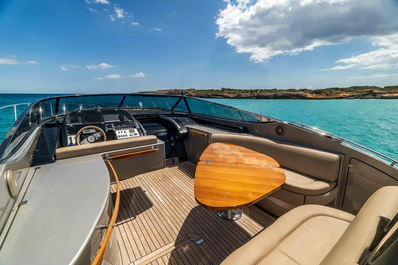 Vimojal II Yacht Photos Pics Luxurious 2009 Riva 52' le yacht interior with elegant seating and ocean view.