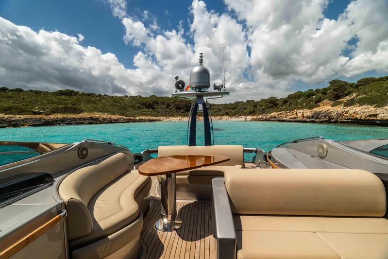 Vimojal II Yacht Photos Pics Luxurious 2009 Riva 52' le yacht with elegant seating, cruising in turquoise waters.