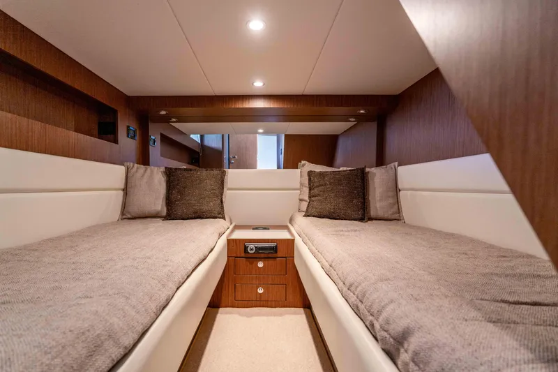 Vimojal II Yacht Photos Pics Luxurious cabin interior of 2009 Riva 52' le yacht with twin beds and elegant wood finish.