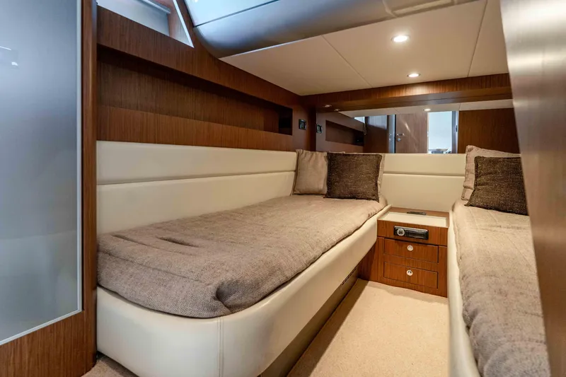 Vimojal II Yacht Photos Pics Luxurious cabin interior of 2009 Riva 52' le yacht with twin beds and wood finish.