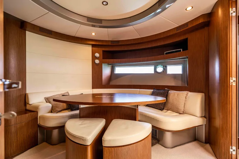 Vimojal II Yacht Photos Pics Luxurious interior of a 2009 Riva 52' le yacht with elegant wood and leather seating.