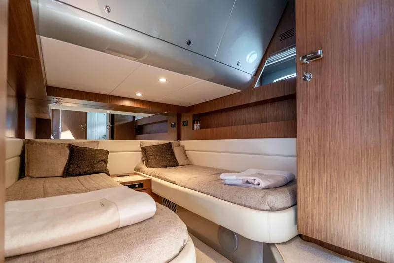 Vimojal II Yacht Photos Pics Luxurious cabin interior of 2009 Riva 52' LE yacht with twin beds and modern design.