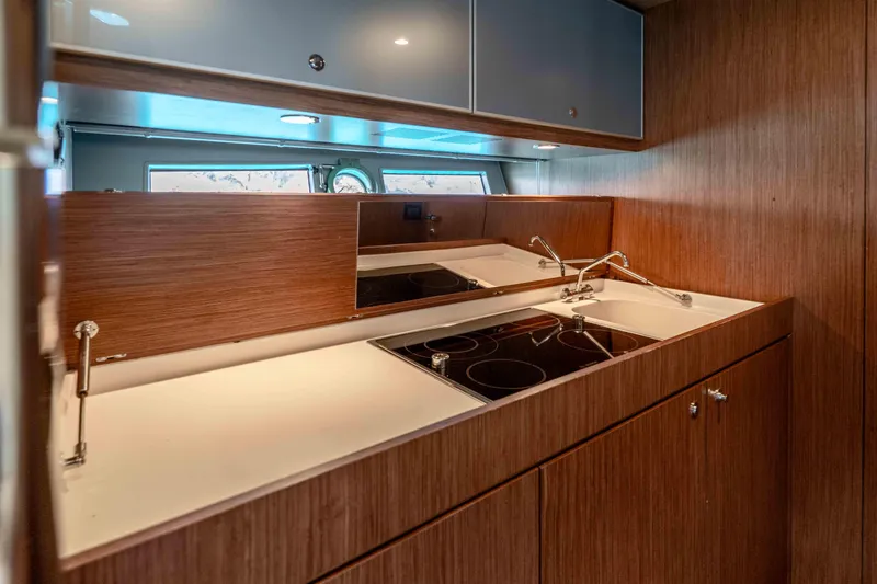 Vimojal II Yacht Photos Pics Luxurious kitchen interior of 2009 Riva 52' LE yacht with modern appliances.
