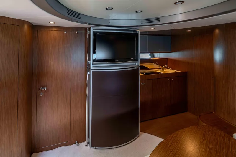 Vimojal II Yacht Photos Pics Luxurious interior of 2009 Riva 52' LE yacht with wood paneling and modern amenities.