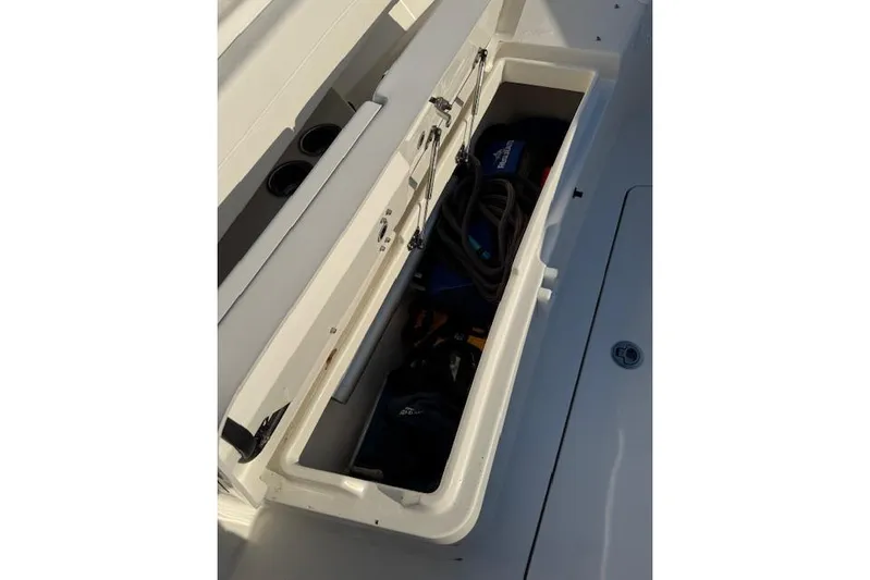  Yacht Photos Pics 2023 Regulator 31 boat storage compartment with gear and accessories.