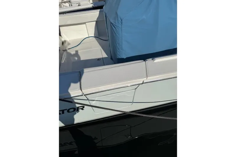  Yacht Photos Pics 2023 Regulator 31 boat with blue cover and white seating.