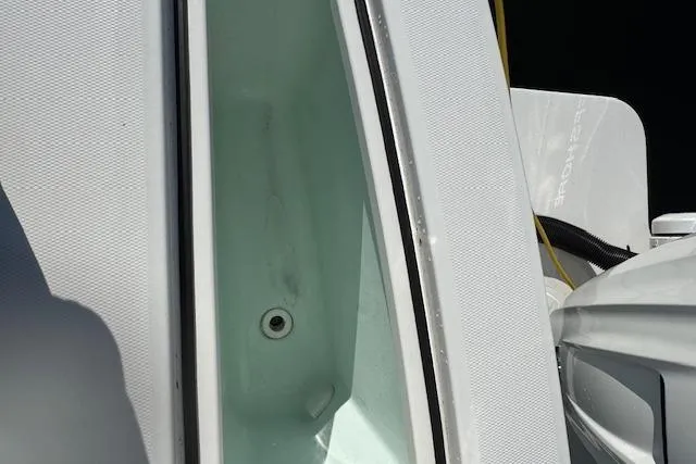  Yacht Photos Pics 2023 Regulator 31 boat deck with storage compartment open.