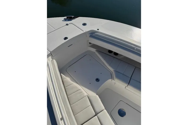  Yacht Photos Pics 2023 Regulator 31 boat interior with cushioned seating and storage compartments.