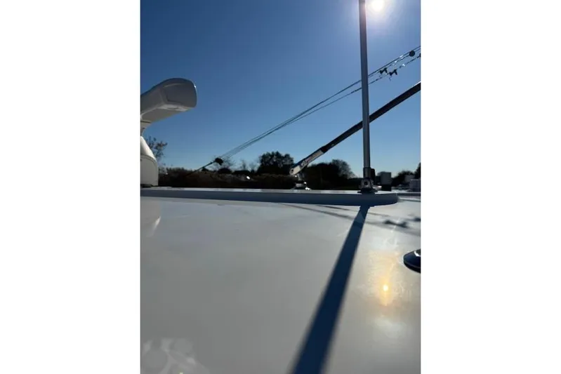  Yacht Photos Pics 2023 Regulator 31 boat deck with clear blue sky and sunlight.