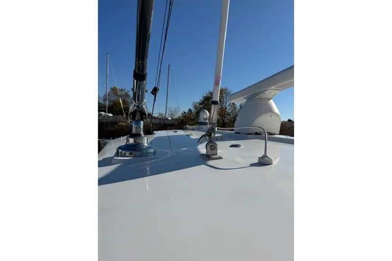  Yacht Photos Pics 2023 Regulator 31 boat deck with antennas and equipment under clear blue sky.