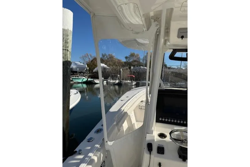  Yacht Photos Pics 2023 Regulator 31 boat interior view at marina, clear skies.