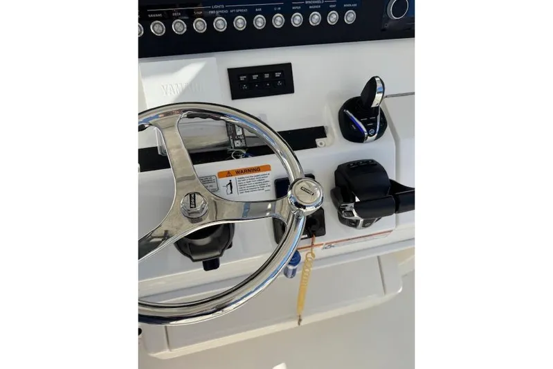  Yacht Photos Pics 2023 Regulator 31 boat helm with steering wheel and controls.