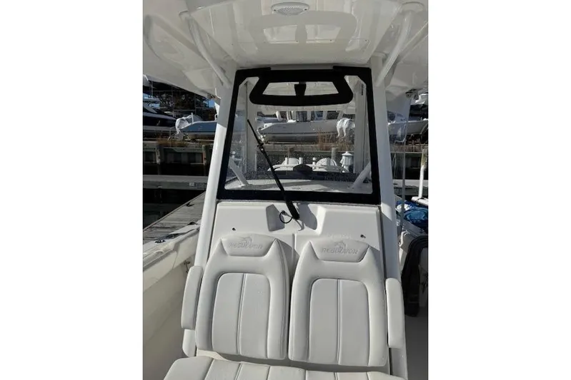  Yacht Photos Pics 2023 Regulator 31 boat interior with white seating and windshield view.